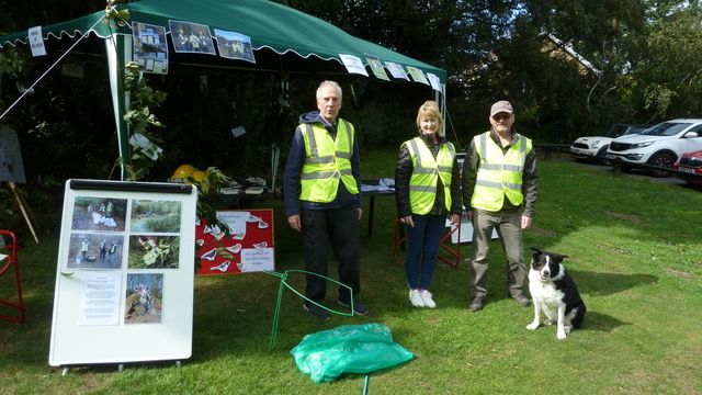 Three friends of Adel Woods stand in front of your gazebo on Alwoodley Village Green on 18 August 2019