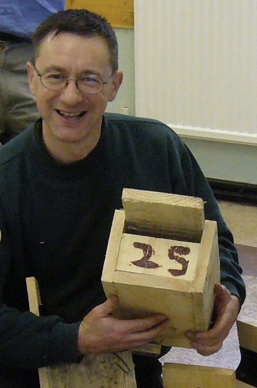 Steve Joul holding a bat box made by Friends of Adel Woods in January 2010