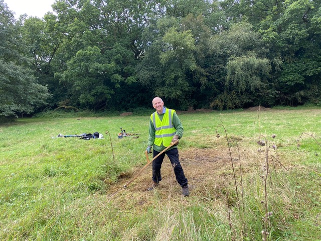 Friends of Adel Woods scything the cricket meadow in Adel Woods