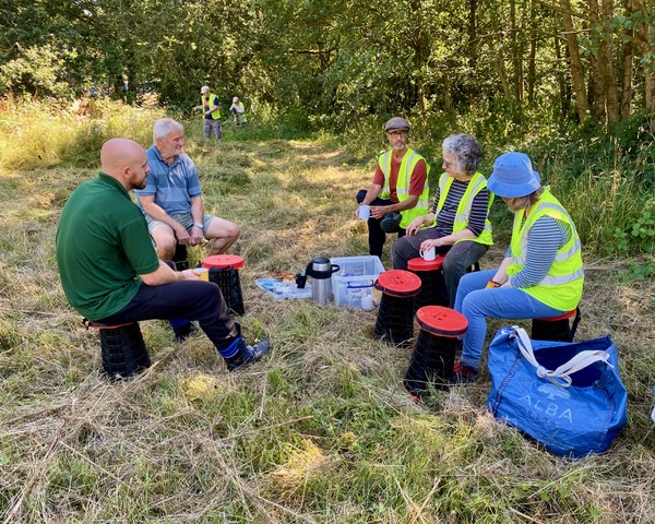 Friends of Adel Woods working on the orchid meadow in Adel Woods